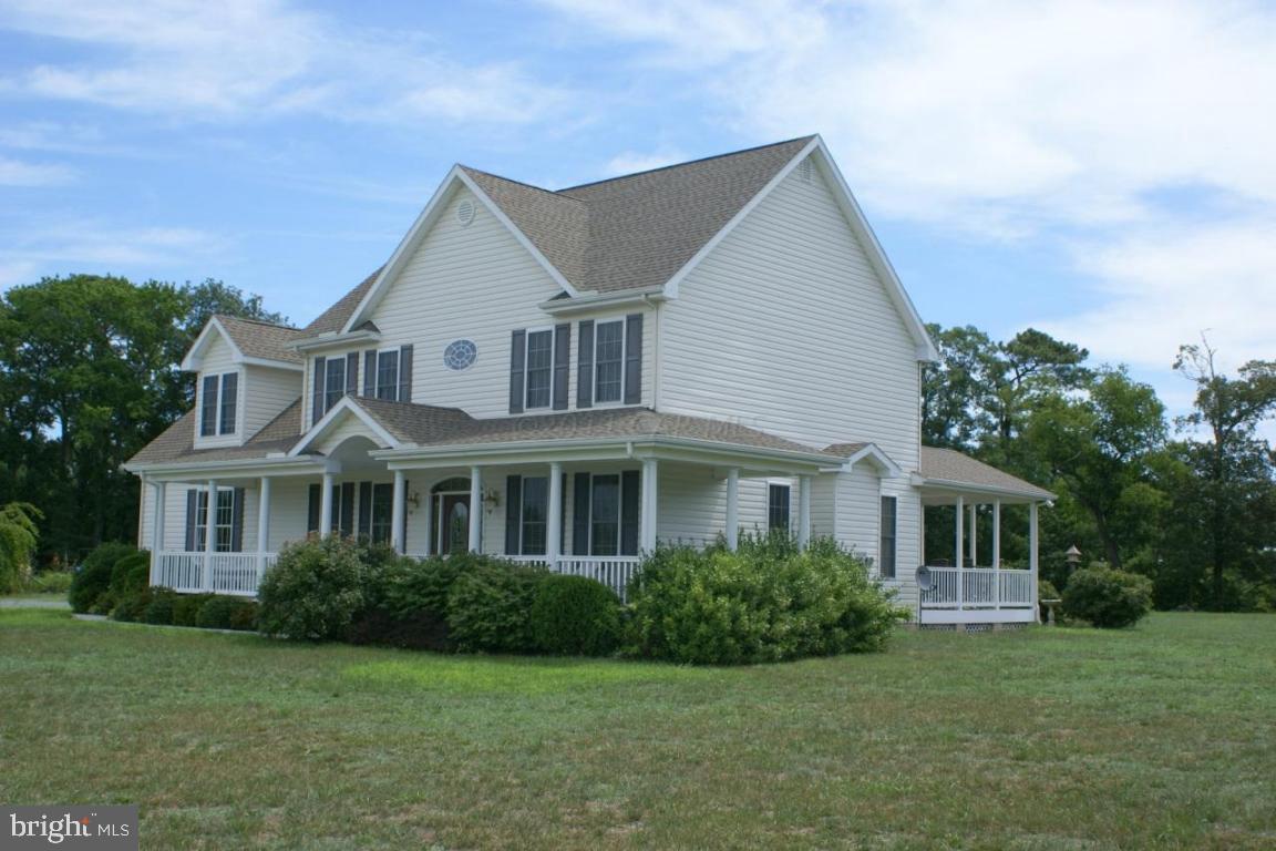 3535 Redden Ferry Road Eden, MD 21822 - Photo 2 of 24 a front view of a house with a garden