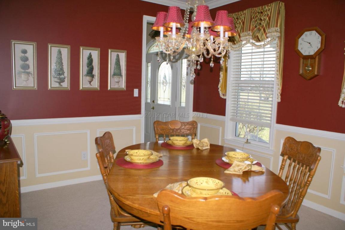 3535 Redden Ferry Road Eden, MD 21822 - Photo 11 of 24 a dining room with furniture and chandelier