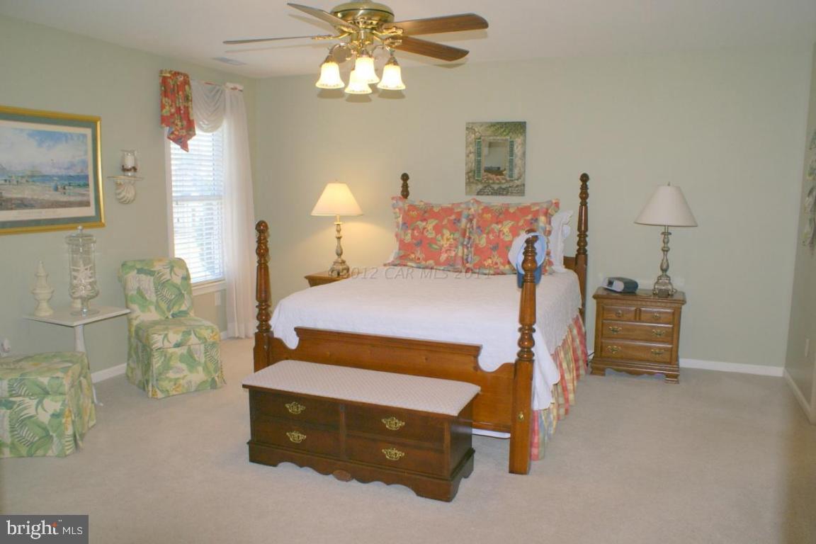 3535 Redden Ferry Road Eden, MD 21822 - Photo 12 of 24 a bedroom with a bed and a chandelier