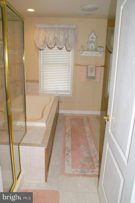 3535 Redden Ferry Road Eden, MD 21822 - Photo 14 of 24 a bathroom with a bathtub and a shower