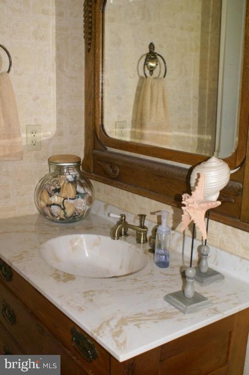 3535 Redden Ferry Road Eden, MD 21822 - Photo 17 of 24 a bathroom with a sink and a mirror