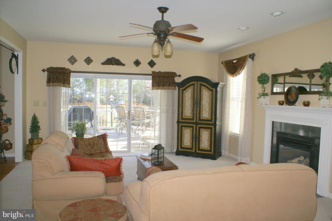 3535 Redden Ferry Road Eden, MD 21822 - Photo 3 of 24 a bedroom with a bed and a fireplace