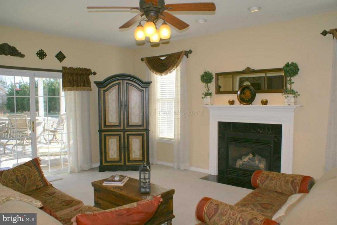 3535 Redden Ferry Road Eden, MD 21822 - Photo 4 of 24 a living room with furniture and a fireplace