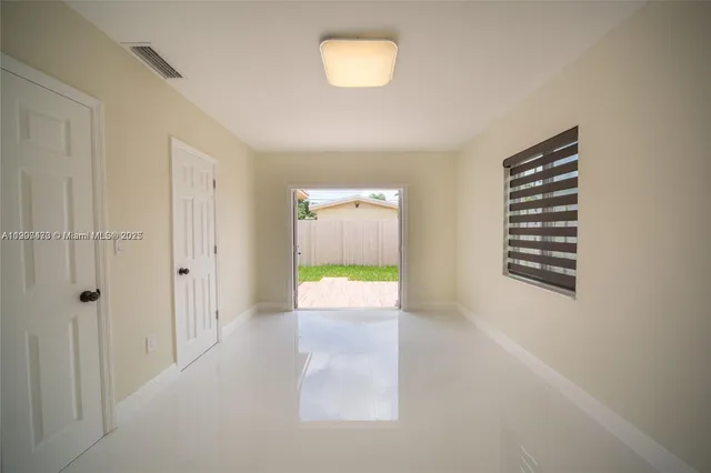 a view of an empty room and window