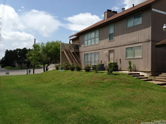a view of a backyard of the house