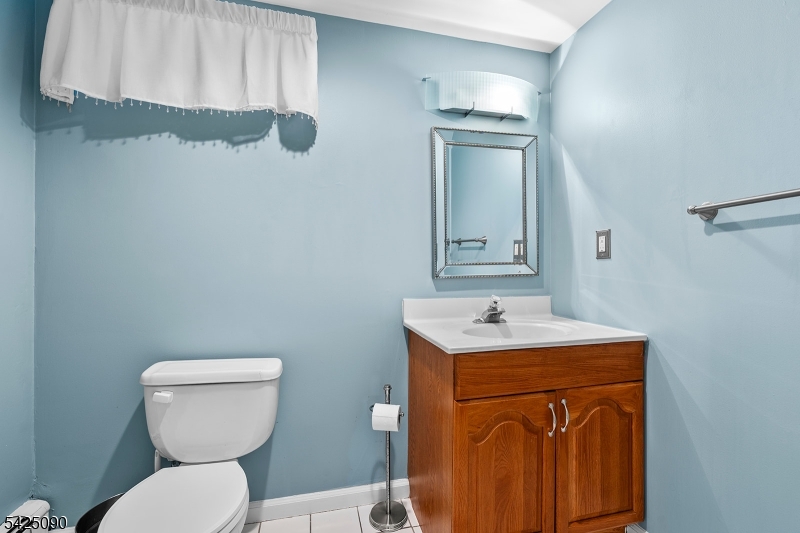 21 Turkey Hill Road Montville, NJ 07005 - Photo 24 of 32 a bathroom with a toilet sink and mirror
