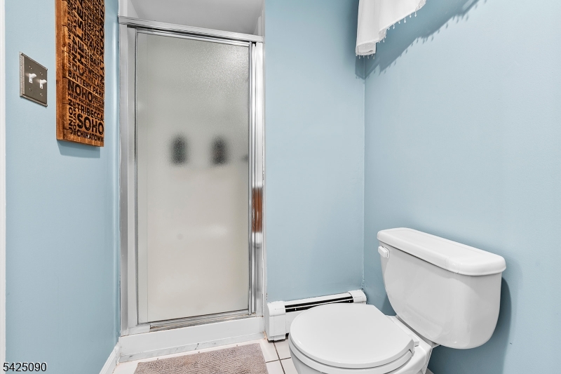 21 Turkey Hill Road Montville, NJ 07005 - Photo 25 of 32 a white toilet sitting next to a shower