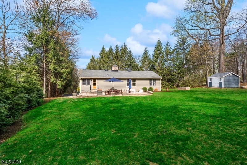 21 Turkey Hill Road Montville, NJ 07005 - Photo 26 of 32 a view of a house with backyard and garden