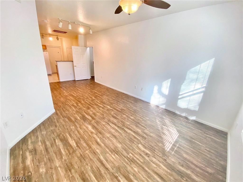 10550 West Alexander Road, Unit 1131 Las Vegas, NV 89129 - Photo 2 of 18 A versatile living space with robust flooring and ample lighting awaits customization.