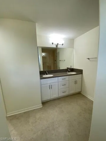 a bathroom with a glass door shower