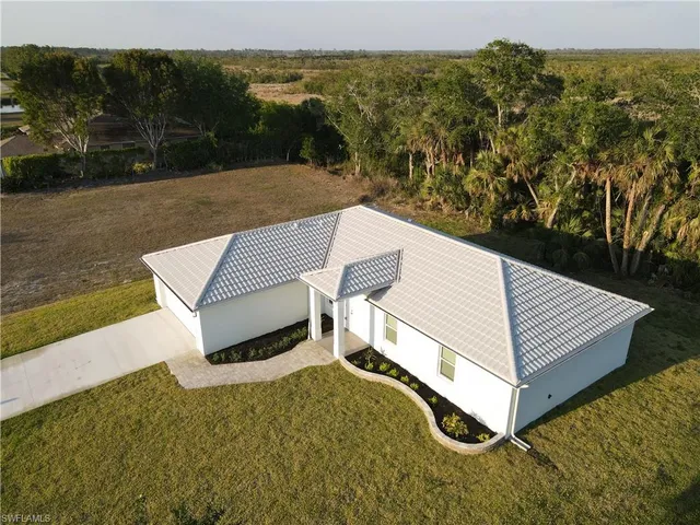 a bathroom with a double vanity sink and mirror
