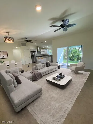 a living room with furniture and a table