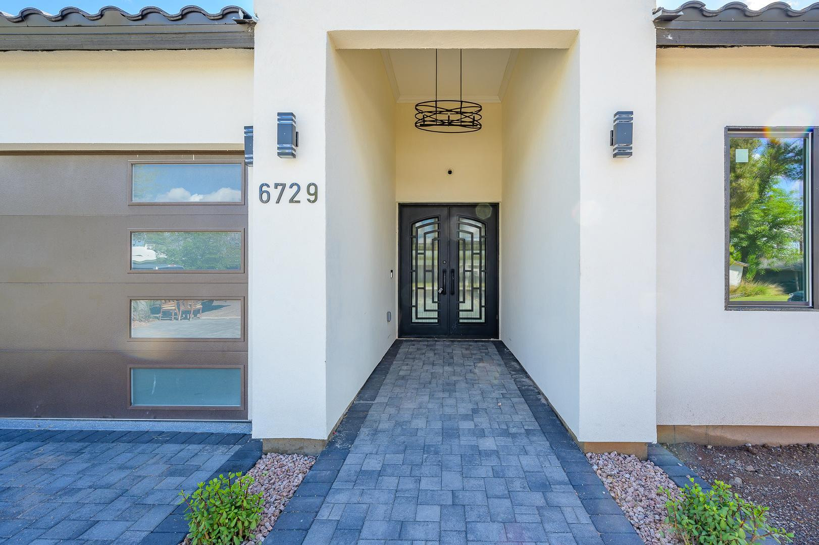 6729 North 13th Street Phoenix, AZ 85014 - Photo 1 of 24 a view of a hallway with wooden floor and a cabinet
