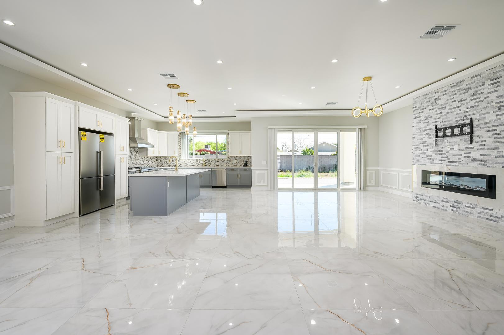 6729 North 13th Street Phoenix, AZ 85014 - Photo 7 of 24 a large white kitchen with a large window