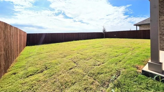 a view of a small space with wooden floor