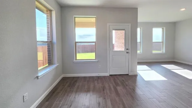 a kitchen with stainless steel appliances granite countertop a sink stove and microwave