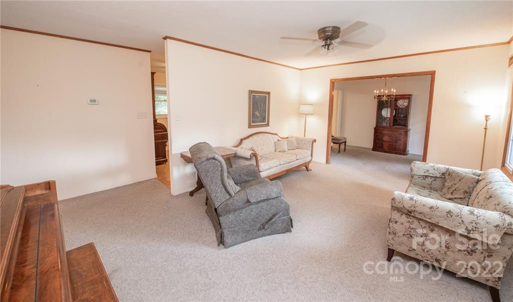 3255 Lake Shore Road South Denver, NC 28037 - Photo 11 of 32 a living room with furniture and a window