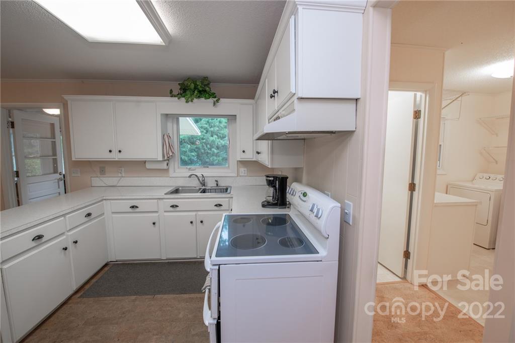 3255 Lake Shore Road South Denver, NC 28037 - Photo 14 of 32 a utility room with cabinets washer and dryer