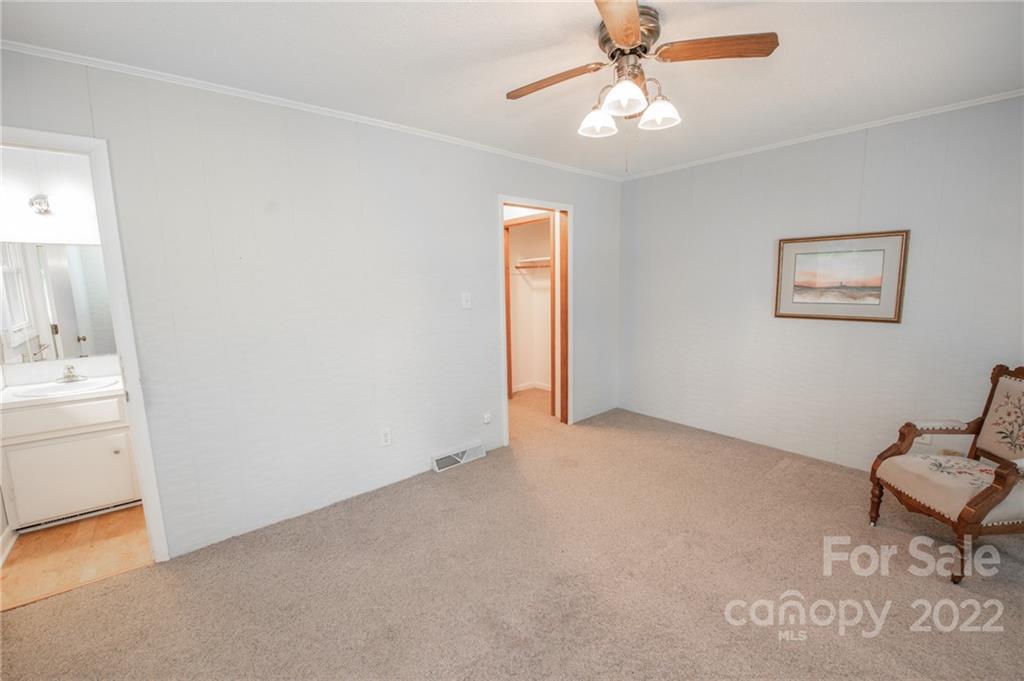 3255 Lake Shore Road South Denver, NC 28037 - Photo 28 of 32 an empty room with windows and fan