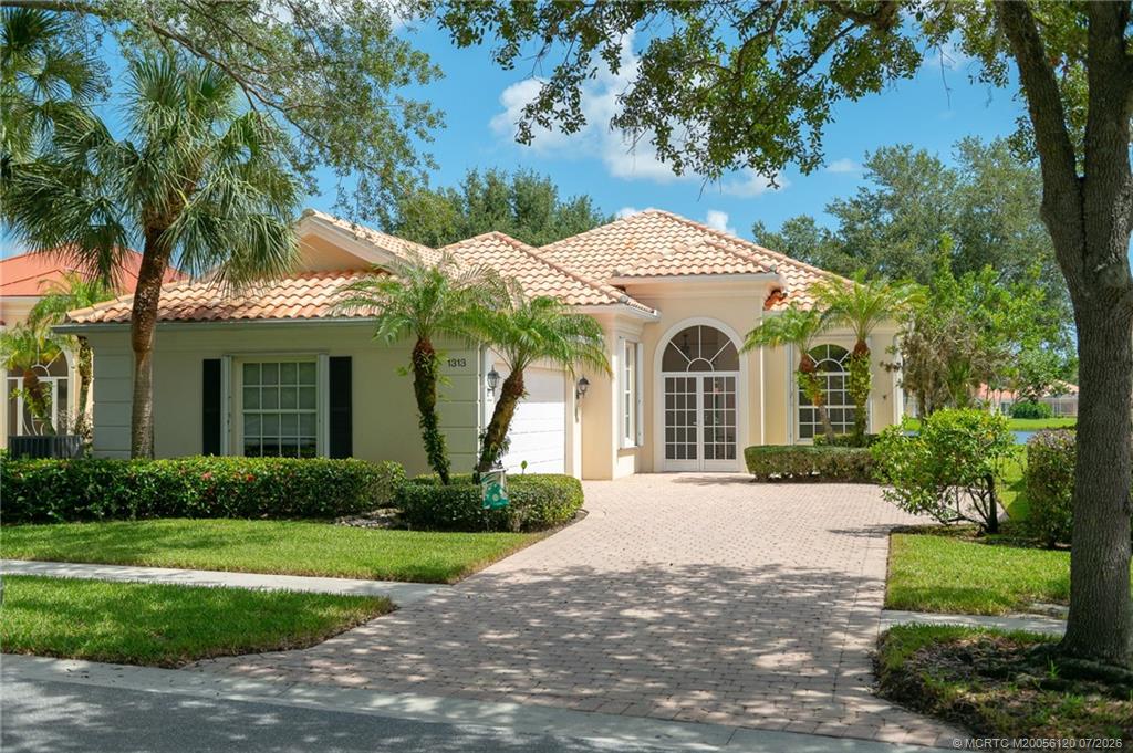 1313 Southwest Balmoral Trace Stuart, FL 34997 - Photo 47 of 70 Extra-long paver driveway enhances the curb appeal