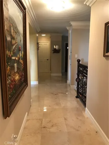 a lobby with furniture and flat screen tv