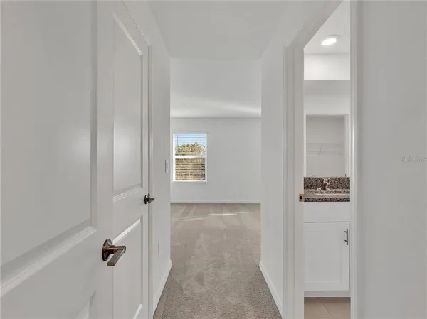 a bathroom with a granite countertop sink mirror and shower