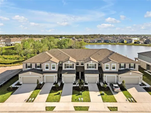 a view of a swimming pool with a yard