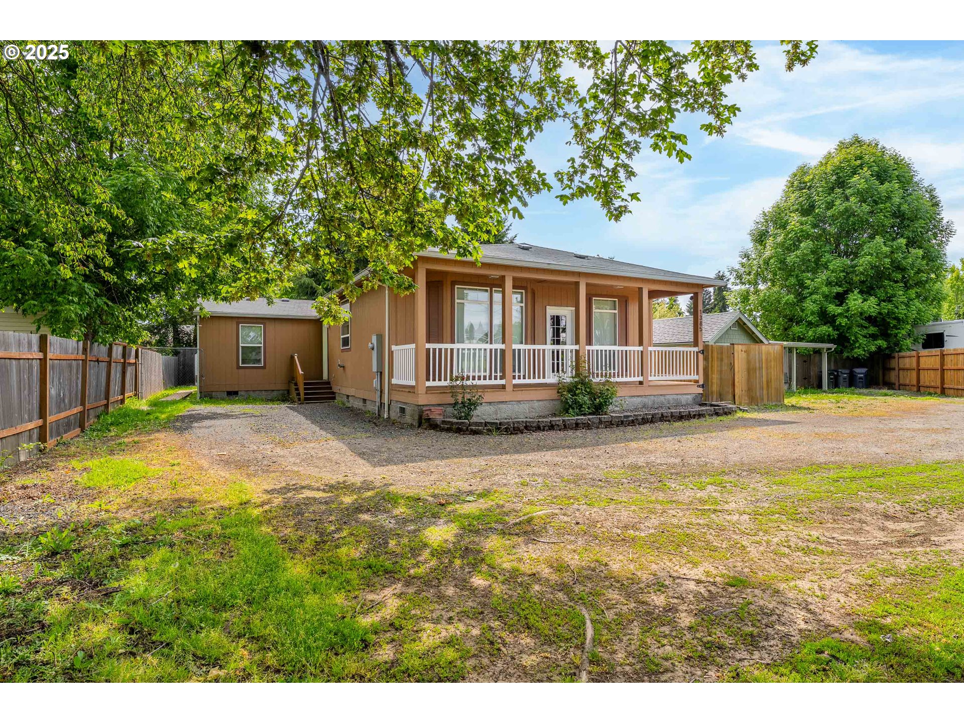 a front view of a house with a yard and a garage