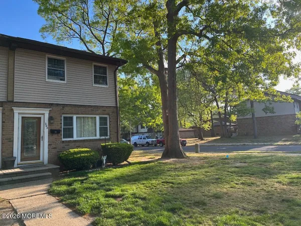 a view of a house with a yard
