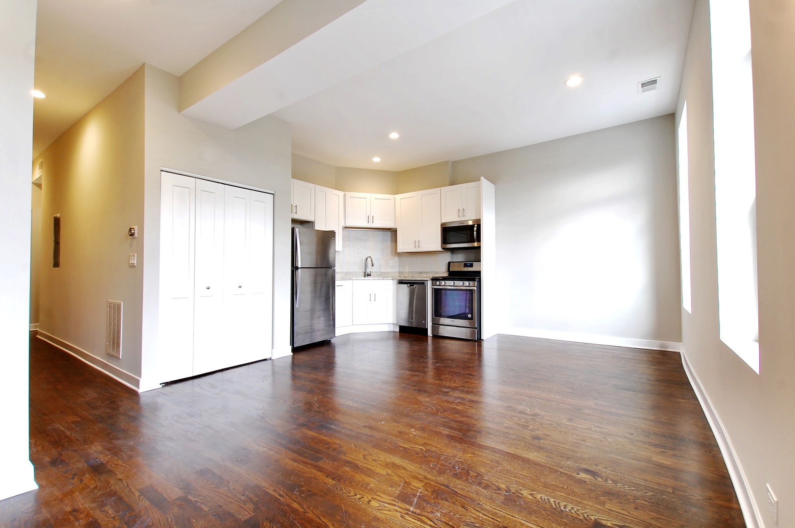 1854 West 18th Street, Unit 2F Chicago, IL 60608 - Photo 2 of 5 a view of kitchen with cabinets and wooden floor