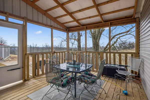 a view of a balcony with furniture