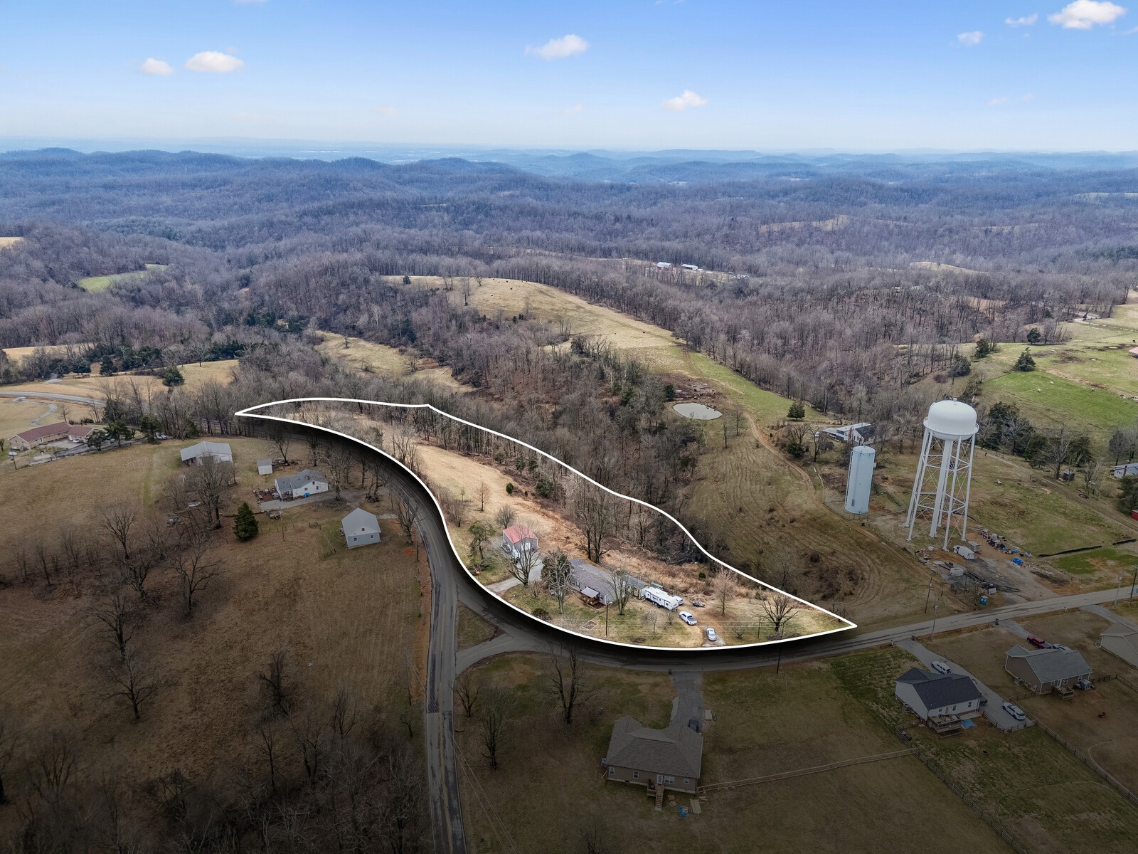 470 James Whitefield Road Bethpage, TN 37022 - Photo 21 of 22 an aerial view of a house with a yard and lake view