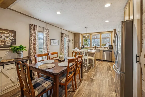 a view of a dining room with furniture window and outside view