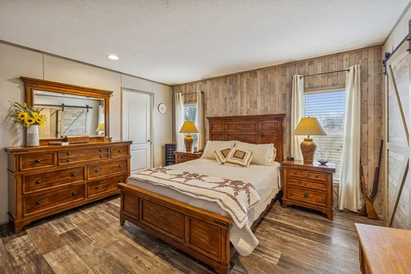 a bedroom with a bed and a dresser