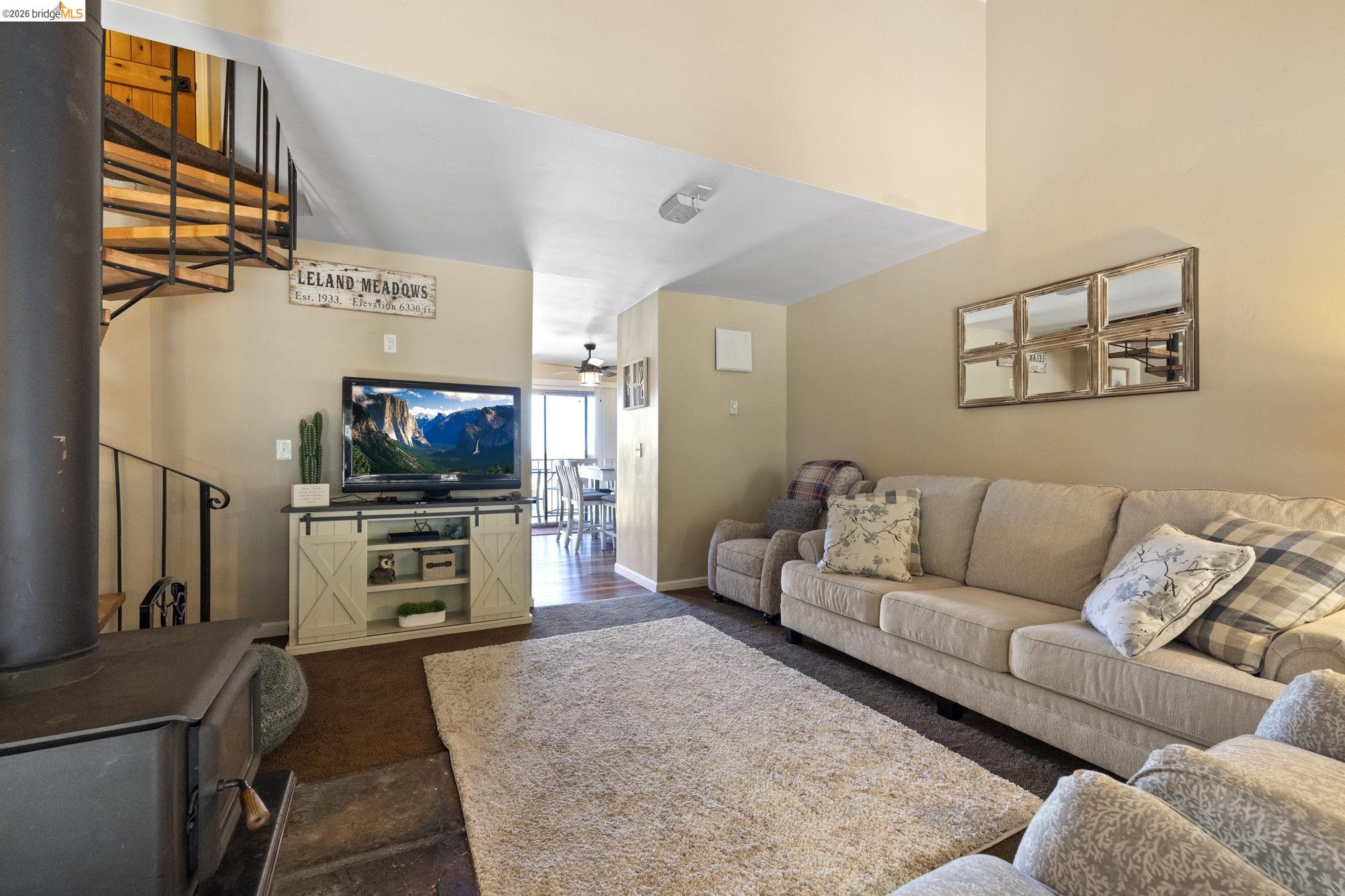 33757 Upper Leland Road, Unit B Pinecrest, CA 95364 - Photo 9 of 39 a living room with furniture and a flat screen tv