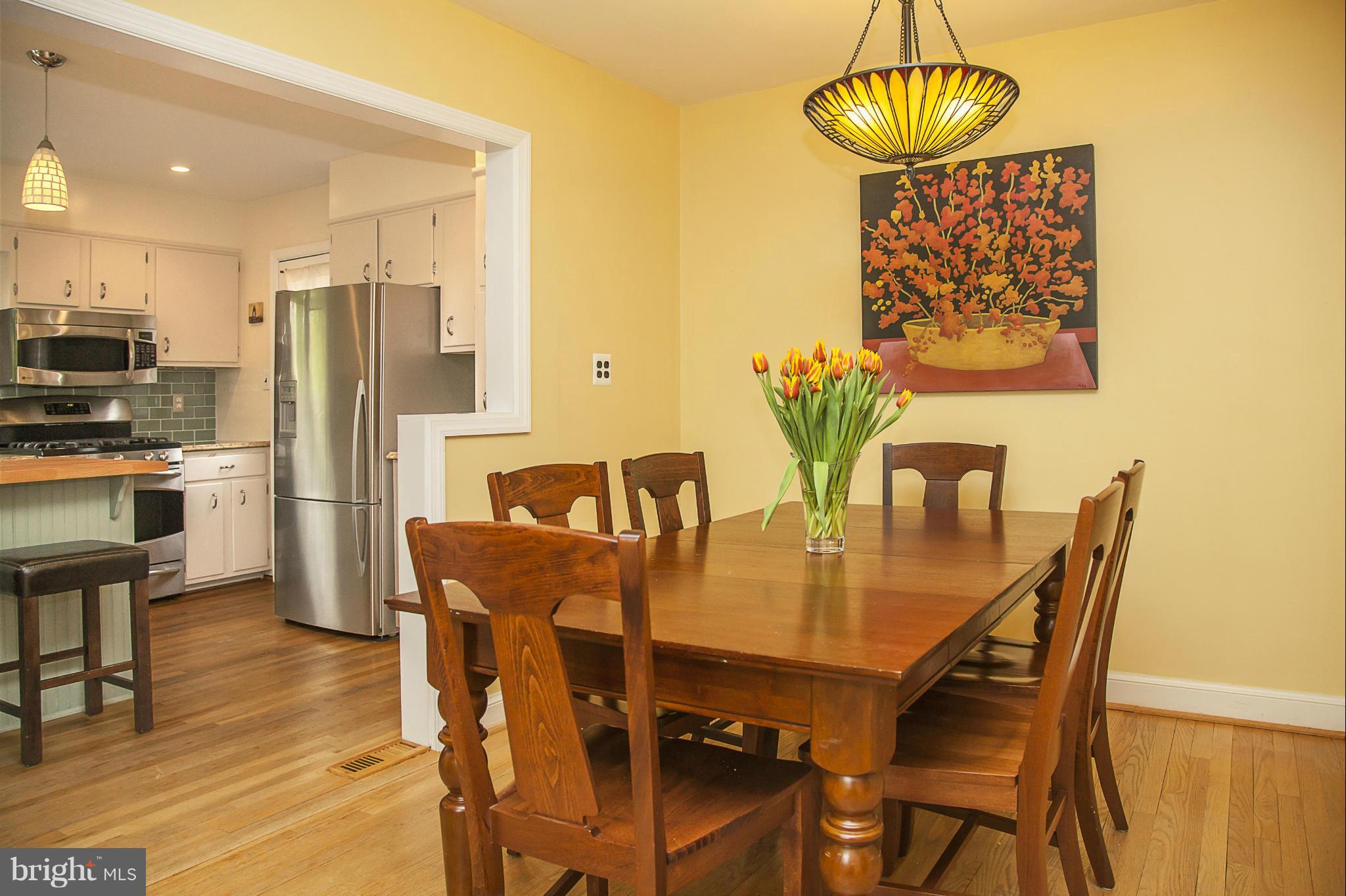 9508 Seminole Street Silver Spring, MD 20901 - Photo 4 of 28 a view of a dining room with furniture and wooden floor