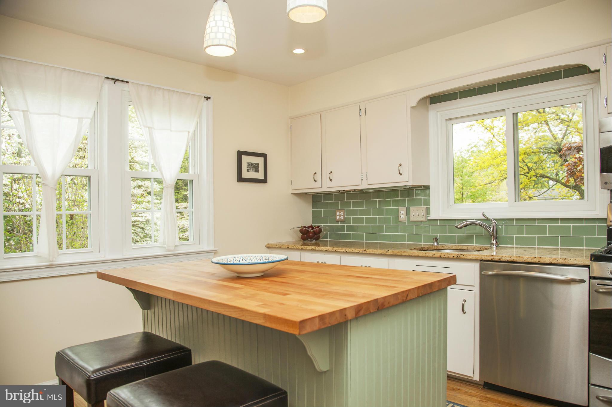 9508 Seminole Street Silver Spring, MD 20901 - Photo 6 of 28 a kitchen with a sink stove and cabinets