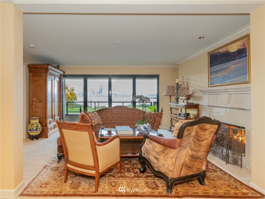 1331 Harbor Avenue Southwest, Unit 103 Seattle, WA 98116 - Photo 16 of 32 a living room with a couch and large windows