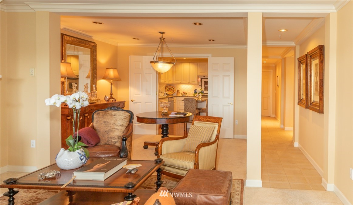 1331 Harbor Avenue Southwest, Unit 103 Seattle, WA 98116 - Photo 17 of 32 a dining room with furniture and wooden floor