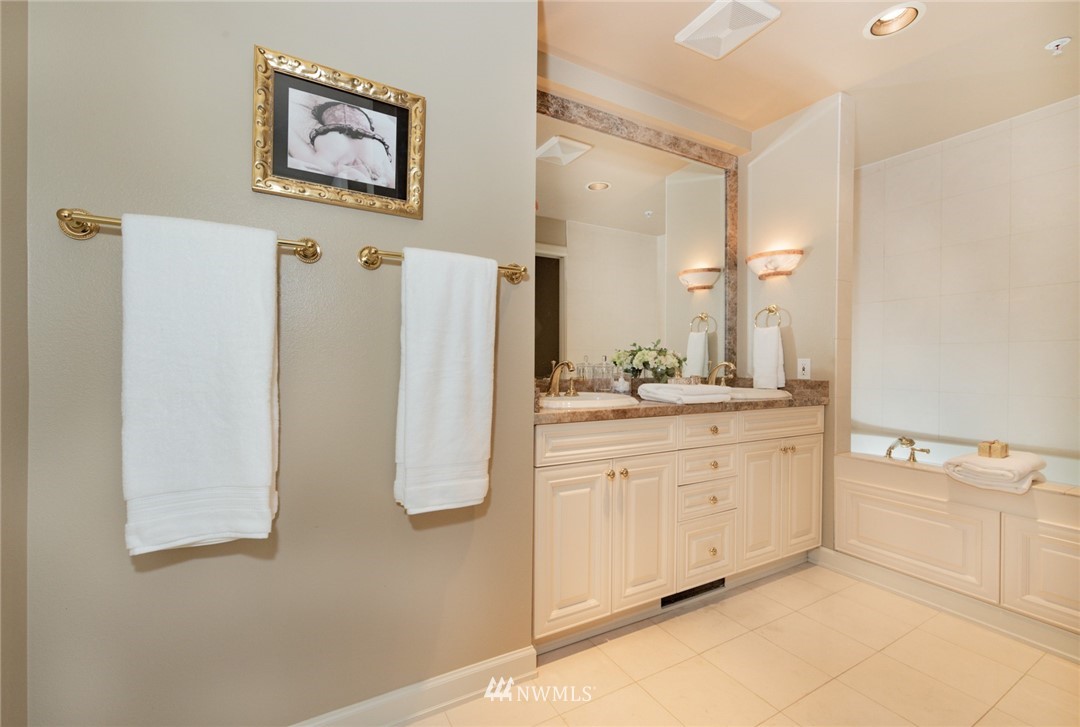 1331 Harbor Avenue Southwest, Unit 103 Seattle, WA 98116 - Photo 23 of 32 a bathroom with a sink and a mirror