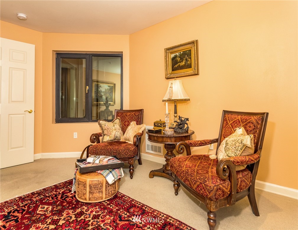 1331 Harbor Avenue Southwest, Unit 103 Seattle, WA 98116 - Photo 30 of 32 a living room with furniture and a window