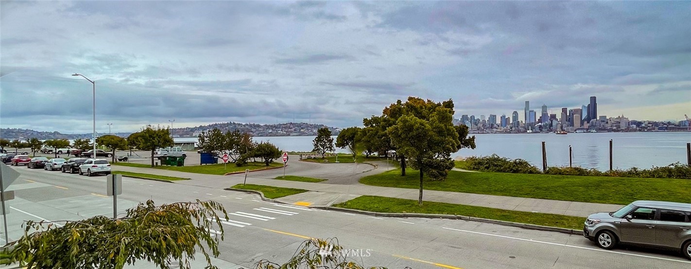1331 Harbor Avenue Southwest, Unit 103 Seattle, WA 98116 - Photo 9 of 32 a view of a street with a cars parked
