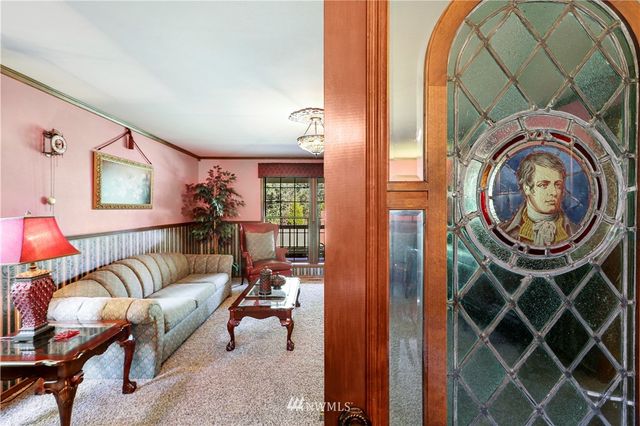 a dining hall with stainless steel appliances a dining table and chairs with the floor