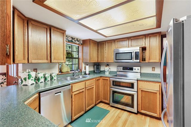 a bedroom with furniture and a fireplace