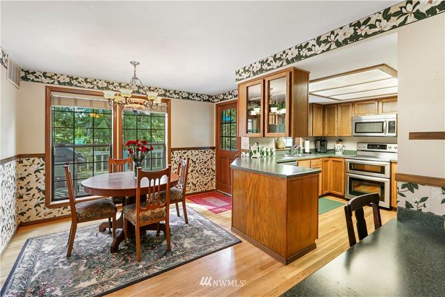 a living room with furniture and stairs