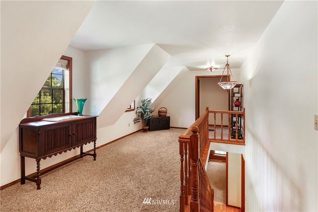 a room with a bed and window