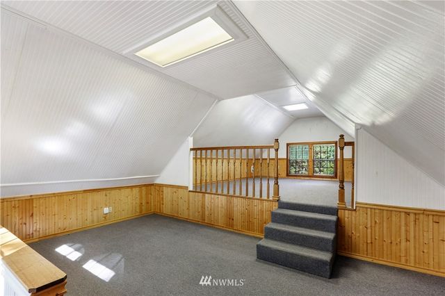 an aerial view of residential houses with outdoor space and street view