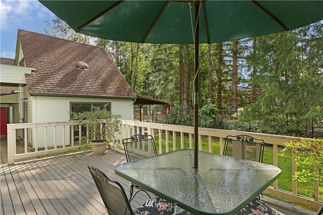 a view of a chairs on wooden deck