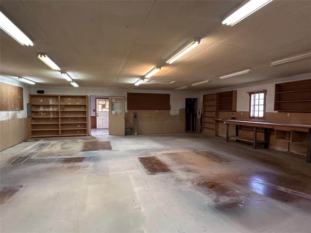 205 First Street Bangs, TX 76823 - Photo 13 of 16 a view of an empty room with a fireplace