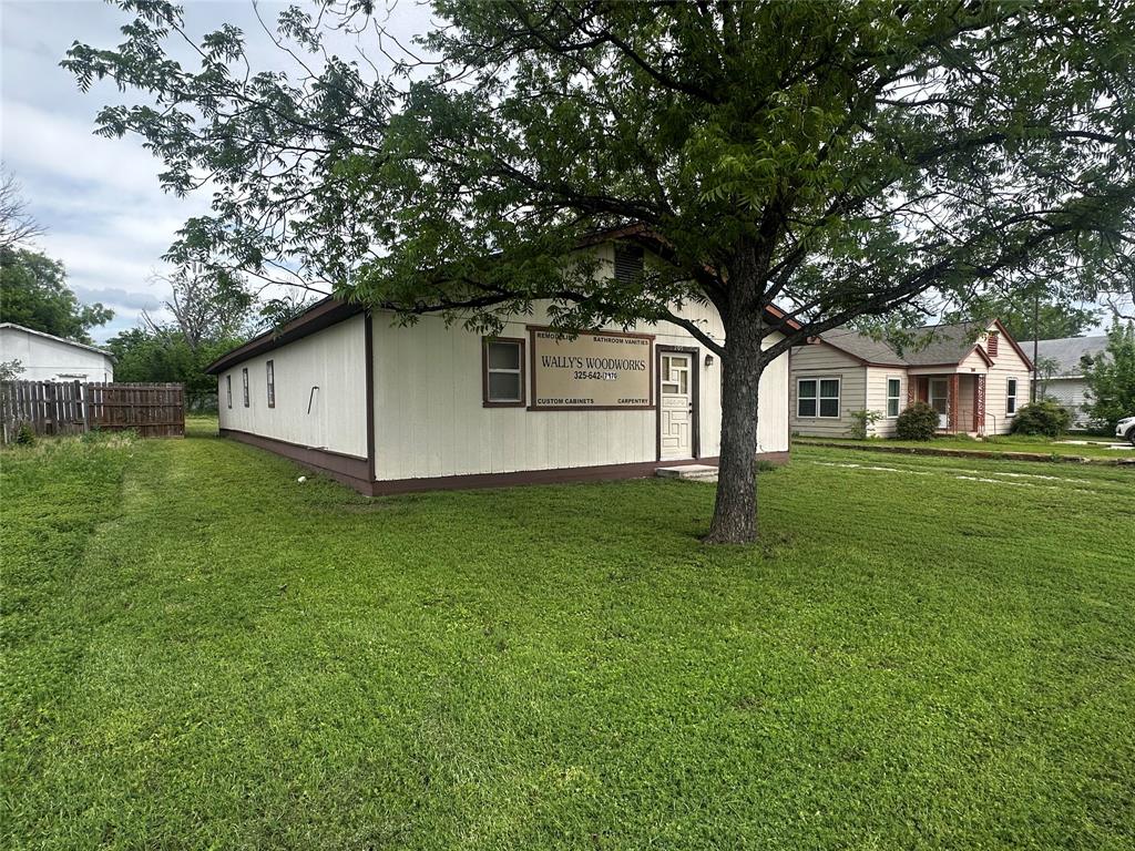 205 First Street Bangs, TX 76823 - Photo 2 of 16 a house view with a garden space